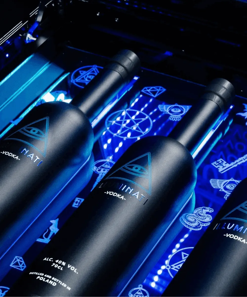 Matte black Illuminati bottles on a blue lit display with the brand symbols